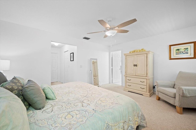 1047 Via Jardin, Riviera Beach, FL 33418 - bedroom featuring light carpet and ceiling fan
