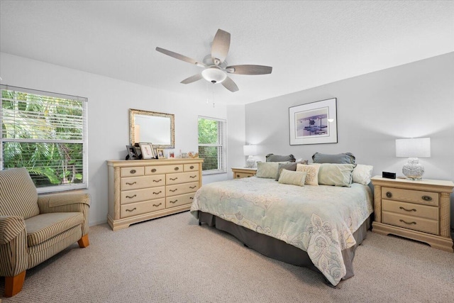 1047 Via Jardin, Riviera Beach, FL 33418 - bedroom with light carpet and ceiling fan