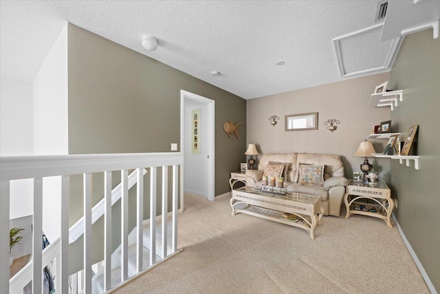 1047 Via Jardin, Riviera Beach, FL 33418 - living room featuring carpet floors, a textured ceiling, and attic access