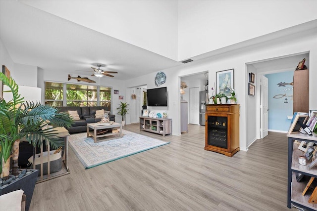 1047 Via Jardin, Riviera Beach, FL 33418 - living area featuring light wood finished floors and ceiling fan