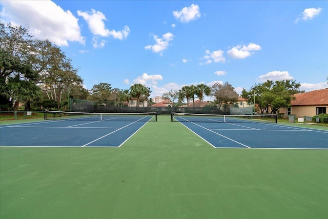 1047 Via Jardin, Riviera Beach, FL 33418 - view of tennis court featuring community basketball court