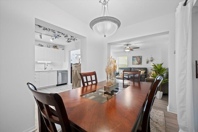 1047 Via Jardin, Riviera Beach, FL 33418 - dining space with light wood-type flooring, ceiling fan, and rail lighting