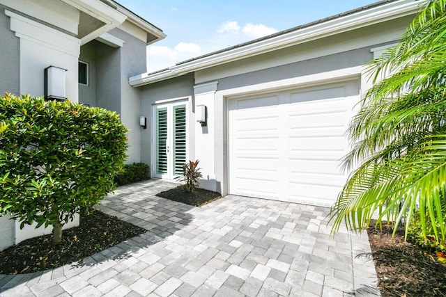 10948 SW Ivory Springs Ln, Port Saint Lucie, FL 34987 - garage featuring decorative driveway