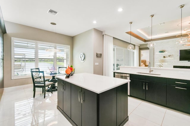 10948 SW Ivory Springs Ln, Port Saint Lucie, FL 34987 - kitchen with a kitchen island, light tile patterned floors, dark cabinetry, and recessed lighting