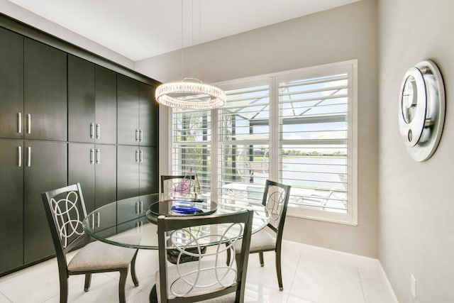 10948 SW Ivory Springs Ln, Port Saint Lucie, FL 34987 - dining space with baseboards and light tile patterned flooring