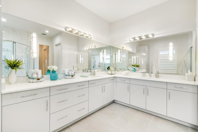 10948 SW Ivory Springs Ln, Port Saint Lucie, FL 34987 - bathroom with double vanity, a shower stall, and tile patterned flooring