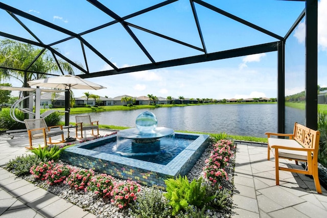 10948 SW Ivory Springs Ln, Port Saint Lucie, FL 34987 - view of patio / terrace with a water view, glass enclosure, and a residential view