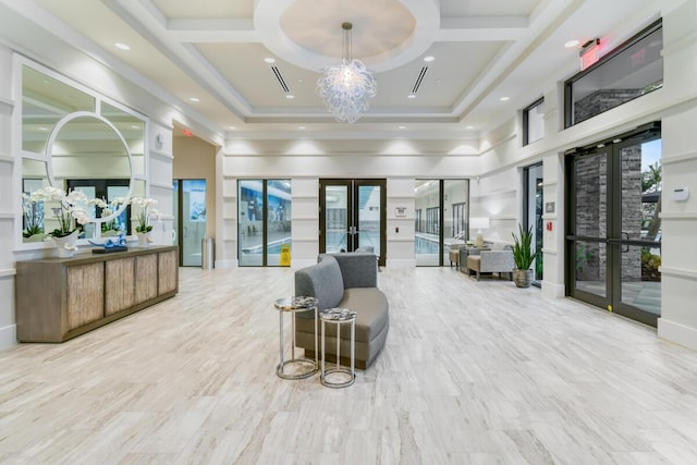 10948 SW Ivory Springs Ln, Port Saint Lucie, FL 34987 - community lobby featuring a towering ceiling and coffered ceiling