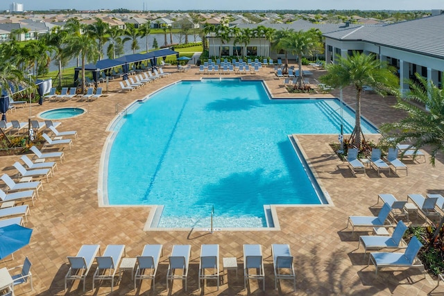 10948 SW Ivory Springs Ln, Port Saint Lucie, FL 34987 - community pool featuring a patio
