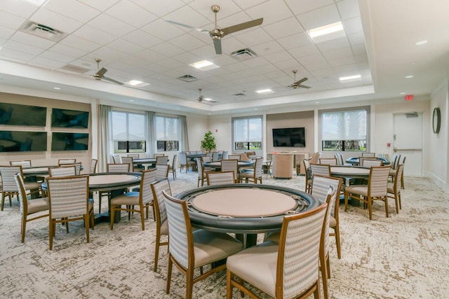 10948 SW Ivory Springs Ln, Port Saint Lucie, FL 34987 - carpeted dining space featuring a tray ceiling and a ceiling fan