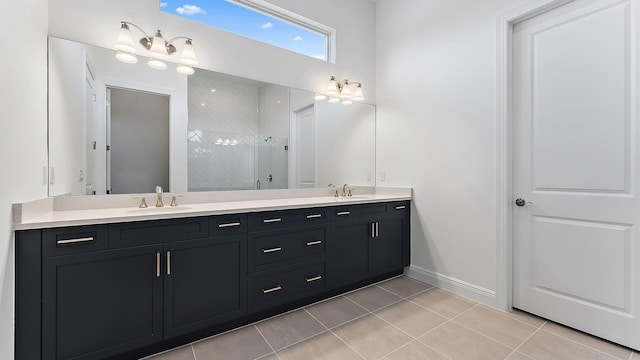 2165 SE Mosaic Blvd, Port Saint Lucie, FL 34984 - bathroom featuring double vanity, tiled shower, and tile patterned flooring