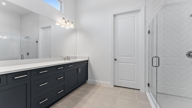 2165 SE Mosaic Blvd, Port Saint Lucie, FL 34984 - bathroom featuring vanity, tile patterned flooring, and a shower stall