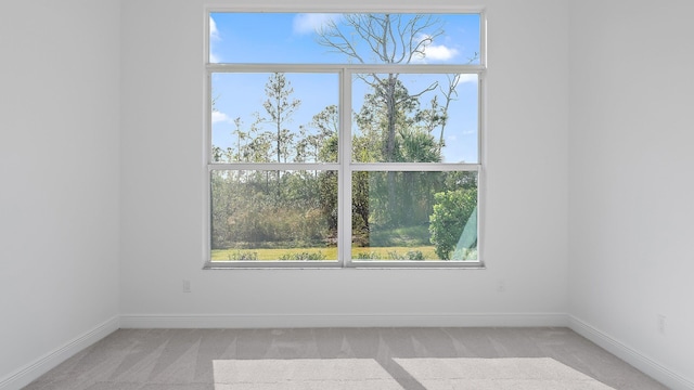 2165 SE Mosaic Blvd, Port Saint Lucie, FL 34984 - unfurnished room featuring light carpet and plenty of natural light