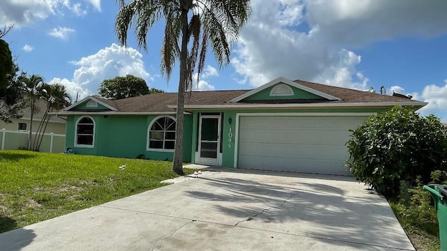 1044 SW Canary Ter, Port Saint Lucie, FL 34953 - ranch-style house featuring driveway, stucco siding, and a garage