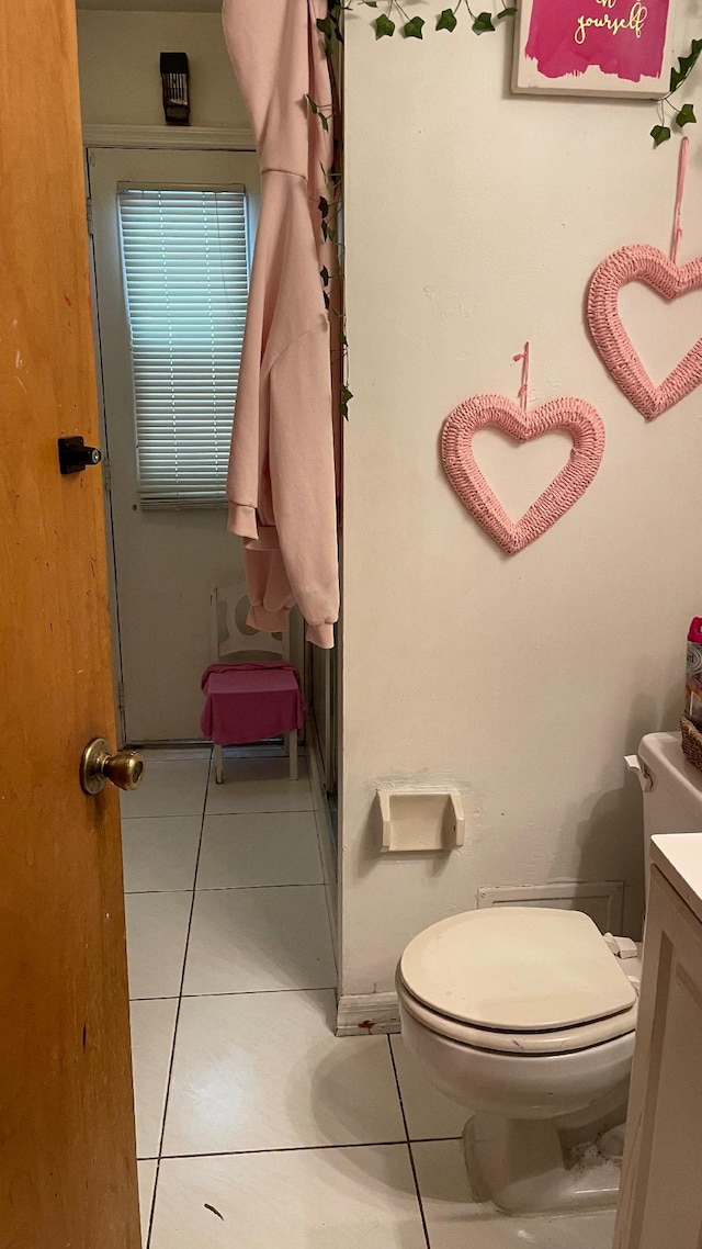 1044 SW Canary Ter, Port Saint Lucie, FL 34953 - bathroom with tile patterned flooring and vanity