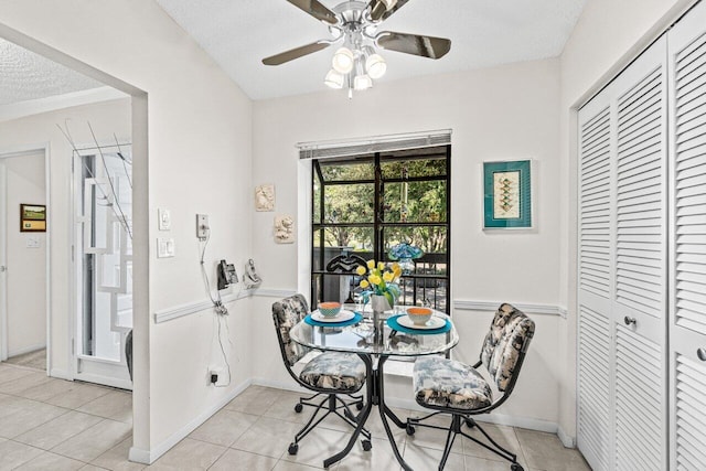 5020 Golfview Ct Unit 1422, Delray Beach, FL 33484 - dining area with a textured ceiling, light tile patterned flooring, and ceiling fan