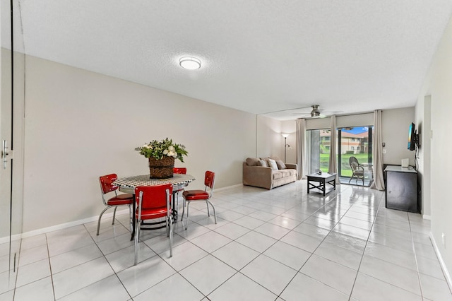 15451 Pembridge Dr Unit 207, Delray Beach, FL 33484 - dining area with a ceiling fan and light tile patterned flooring