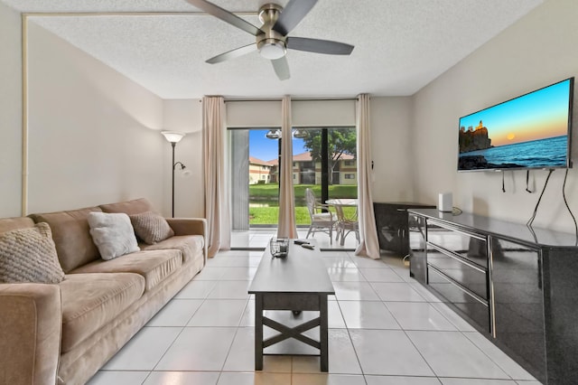 15451 Pembridge Dr Unit 207, Delray Beach, FL 33484 - living area with a ceiling fan and a textured ceiling