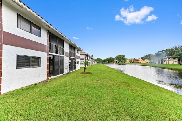 15451 Pembridge Dr Unit 207, Delray Beach, FL 33484 - view of grassy yard featuring a water view and a residential view