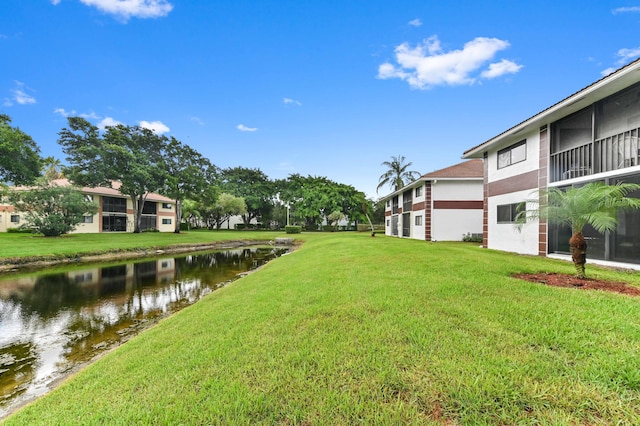 15451 Pembridge Dr Unit 207, Delray Beach, FL 33484 - view of green lawn featuring a water view