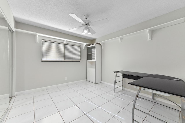 15451 Pembridge Dr Unit 207, Delray Beach, FL 33484 - unfurnished room with ceiling fan, a textured ceiling, and light tile patterned floors