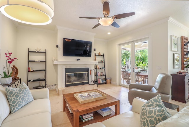 15687 83rd Way N, Palm Beach Gardens, FL 33418 - living area with ceiling fan, ornamental molding, a tile fireplace, light tile patterned floors, and a textured ceiling