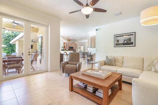 15687 83rd Way N, Palm Beach Gardens, FL 33418 - living area with a ceiling fan, healthy amount of natural light, crown molding, light tile patterned floors, and french doors