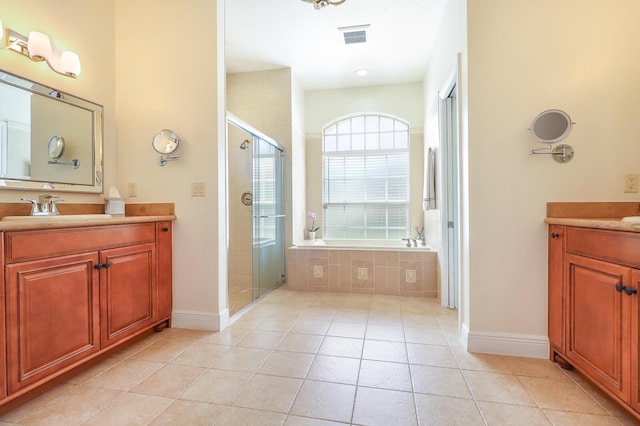 15687 83rd Way N, Palm Beach Gardens, FL 33418 - full bathroom featuring vanity, a shower stall, a bath, and tile patterned flooring