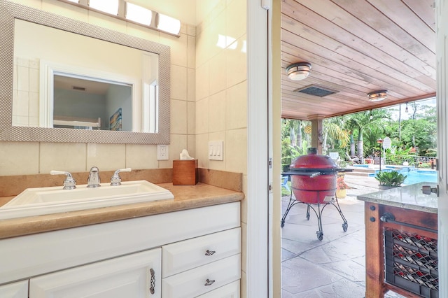 15687 83rd Way N, Palm Beach Gardens, FL 33418 - bathroom with vanity and wood ceiling