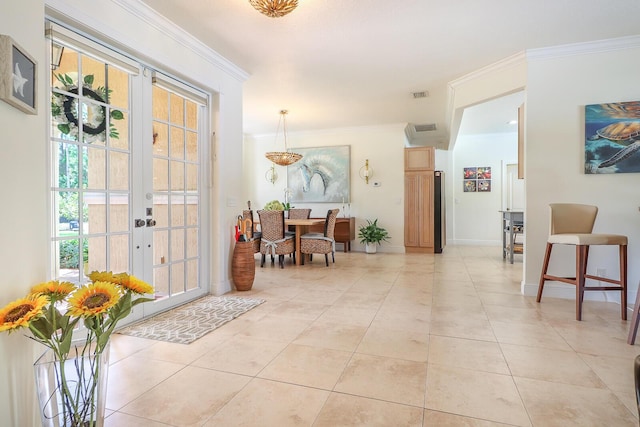 15687 83rd Way N, Palm Beach Gardens, FL 33418 - foyer entrance with plenty of natural light, crown molding, light tile patterned floors, and french doors