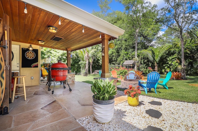 15687 83rd Way N, Palm Beach Gardens, FL 33418 - view of patio featuring a fire pit and area for grilling