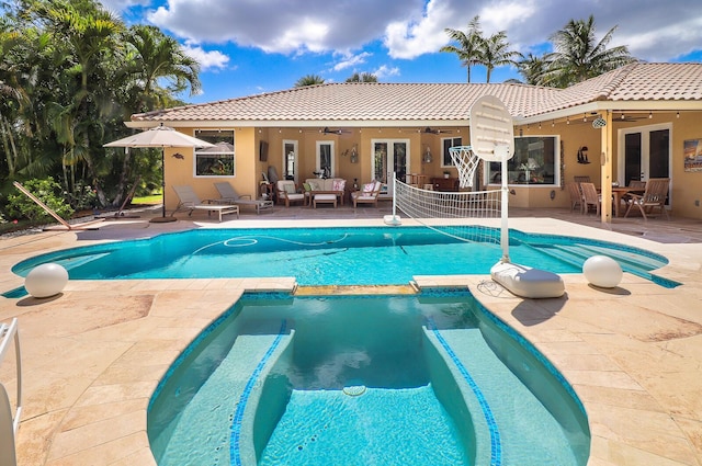 15687 83rd Way N, Palm Beach Gardens, FL 33418 - view of pool featuring a ceiling fan, an outdoor hangout area, a pool with connected hot tub, french doors, and a patio area