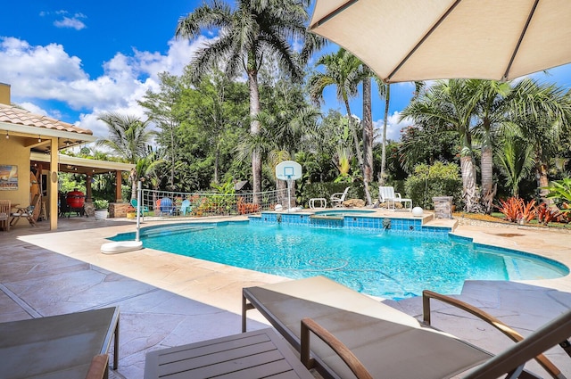 15687 83rd Way N, Palm Beach Gardens, FL 33418 - view of pool with a patio and a pool with connected hot tub