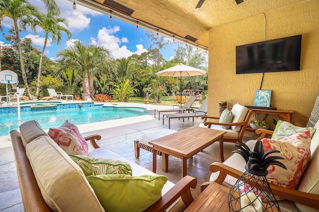15687 83rd Way N, Palm Beach Gardens, FL 33418 - view of swimming pool featuring a patio, outdoor lounge area, a pool with connected hot tub, and ceiling fan