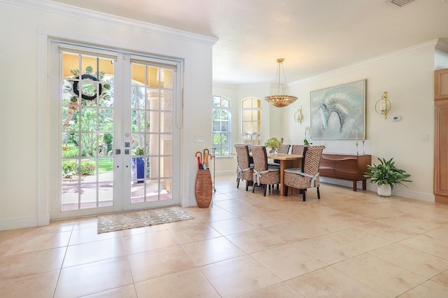 15687 83rd Way N, Palm Beach Gardens, FL 33418 - dining area with crown molding, french doors, and light tile patterned floors