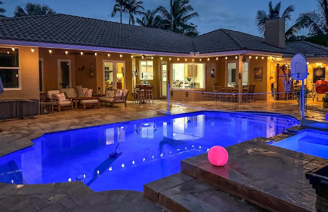 15687 83rd Way N, Palm Beach Gardens, FL 33418 - view of pool featuring a patio, an outdoor hangout area, and a pool with connected hot tub