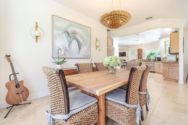 15687 83rd Way N, Palm Beach Gardens, FL 33418 - dining space with light tile patterned floors and crown molding