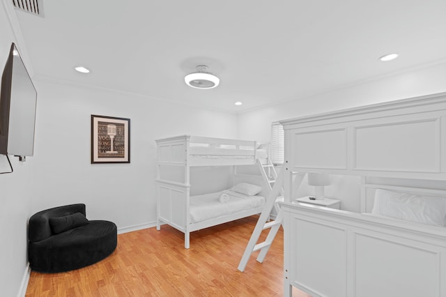 1501 SE 14th St, Deerfield Beach, FL 33441 - bedroom with light wood finished floors, crown molding, and recessed lighting