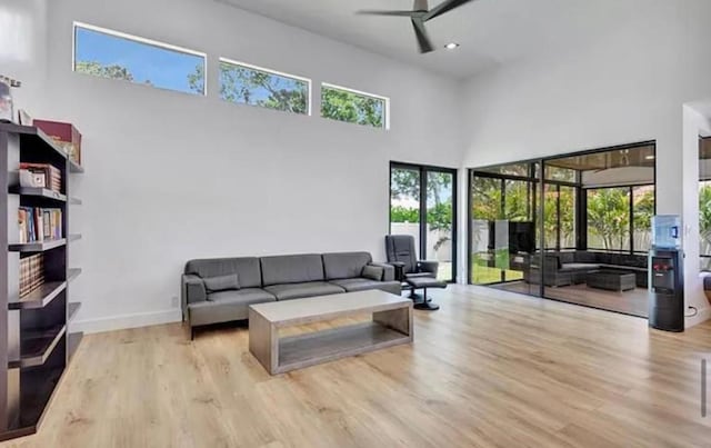 2299 NW 55th St, Boca Raton, FL 33496 - living room with a high ceiling, wood finished floors, plenty of natural light, ceiling fan, and recessed lighting
