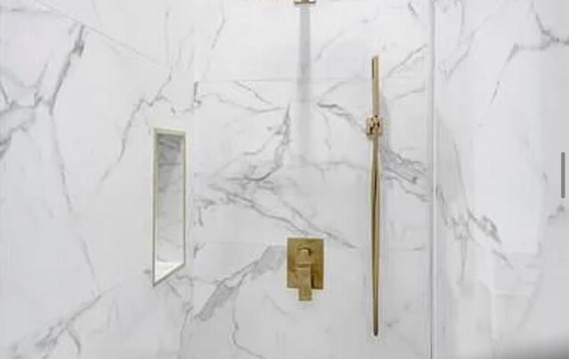 2299 NW 55th St, Boca Raton, FL 33496 - bathroom view of a marble finish shower