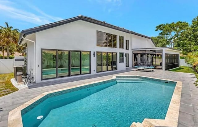 2299 NW 55th St, Boca Raton, FL 33496 - rear view of house with a patio area and stucco siding
