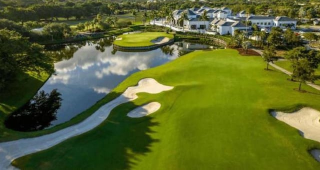 2299 NW 55th St, Boca Raton, FL 33496 - aerial perspective of suburban area with a golf club and a large body of water