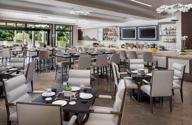 2299 NW 55th St, Boca Raton, FL 33496 - dining space with a chandelier and a community bar