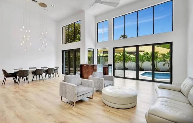 2299 NW 55th St, Boca Raton, FL 33496 - living area with a high ceiling and wood finished floors
