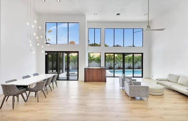 2299 NW 55th St, Boca Raton, FL 33496 - living area featuring light wood finished floors and a high ceiling