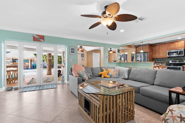 1098 SW 2nd St, Boca Raton, FL 33486 - living area featuring a ceiling fan, french doors, light tile patterned flooring, and crown molding