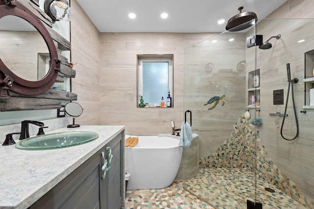 1098 SW 2nd St, Boca Raton, FL 33486 - full bath with a shower stall, a freestanding bath, vanity, tile walls, and recessed lighting