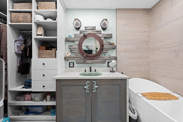 1098 SW 2nd St, Boca Raton, FL 33486 - full bathroom with vanity, a walk in closet, and a bath
