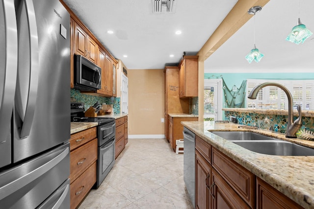 1098 SW 2nd St, Boca Raton, FL 33486 - kitchen featuring stainless steel appliances, decorative backsplash, hanging light fixtures, light stone counters, and recessed lighting