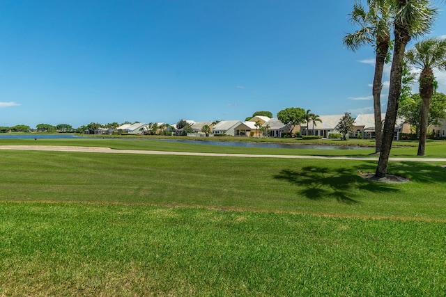 8057 Cassia Dr, Boynton Beach, FL 33472 - view of community featuring a residential view, a water view, and a yard